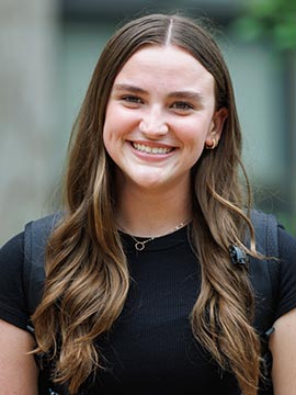 Mae headshot A portrait of Mae, a former 1818 student