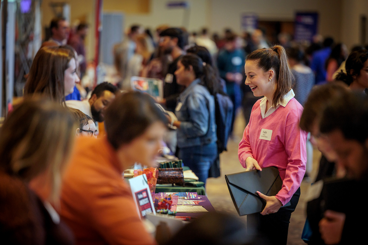 Career Fair students speak with potential employers at the career expo