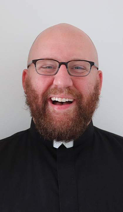 Headshot of a smiling Ken Homan