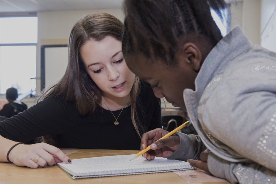 Teacher instructing student