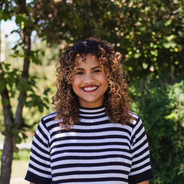 Clara Reyes smiling in a professional headshot.