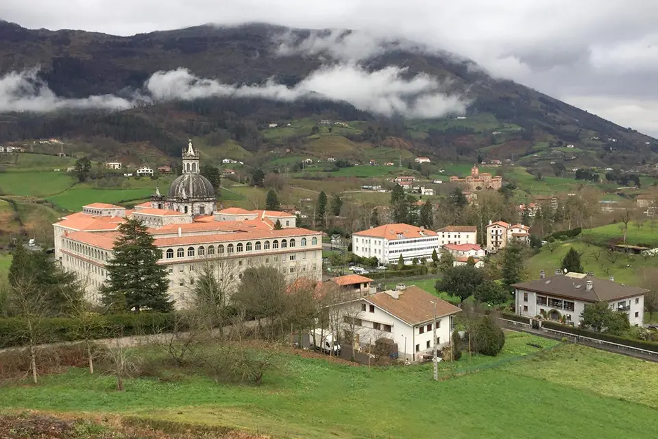 Sanctuary of Loyola in Azpeitia, Basque Country, Spain. Aerial shot of sanctuary and basilica with lush greenery in the background.
