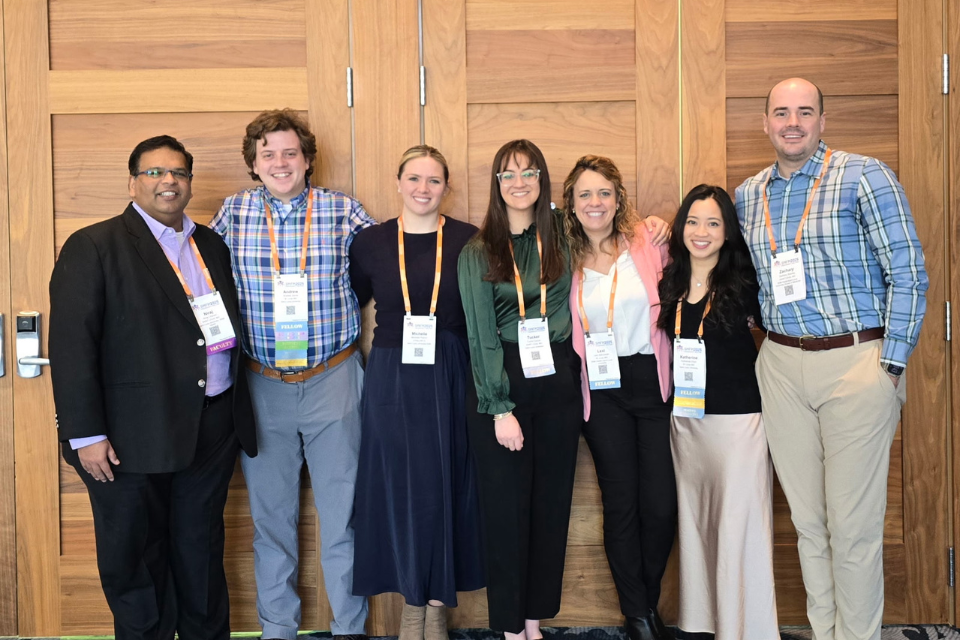 SLU's 2025 class of fellows pose for a photo at an event.