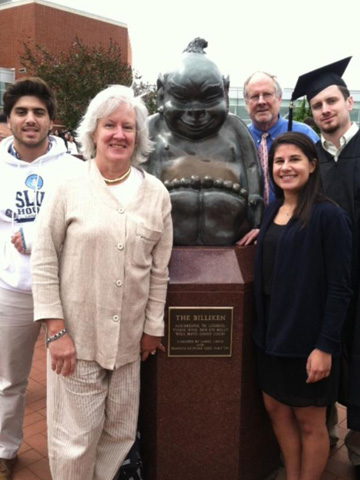 The Milburn family with the Billiken statue The Milburn family with the Billiken statue