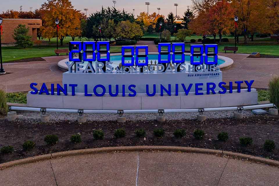 A large timer displaying the years, hours, minutes and seconds of service completed as part of SLU 200 years of service challenge.
